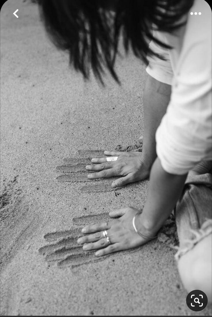 Hands in sand